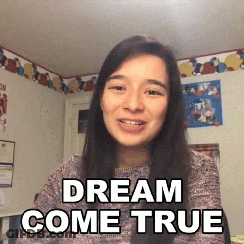 Woman Saying Dream Come True In Front Of Picture Wall GIF