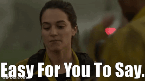Woman Saying Easy For You To Say To Man In Yellow Jacket GIF