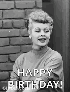 Woman Saying Happy Birthday By Brick Wall GIF