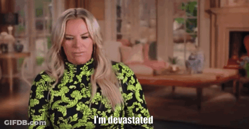 Woman Saying I Am Devastated In Front Of Moonshine Ad GIF
