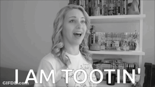Woman Saying I Am Tootin In Front Of Bookshelf GIF