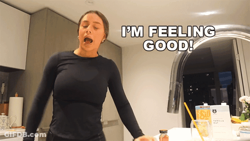 Woman Saying I'm Feeling Good In Front Of Sink GIF