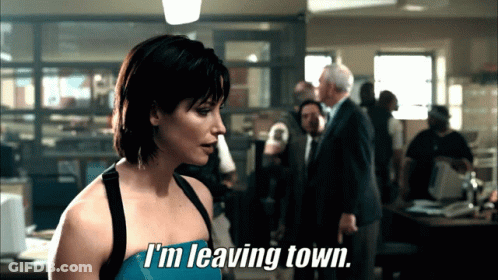 Woman Saying I'm Leaving Town In Front Of Group GIF