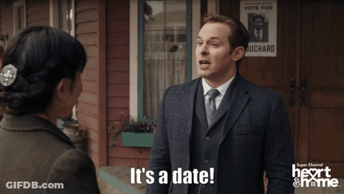 Woman Saying It's A Date Next To Man In Suit GIF