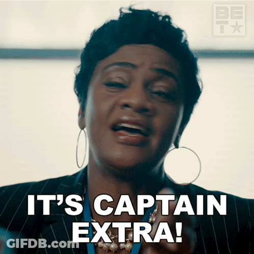 Woman Saying It's Captain Extra With Hoop Earrings GIF