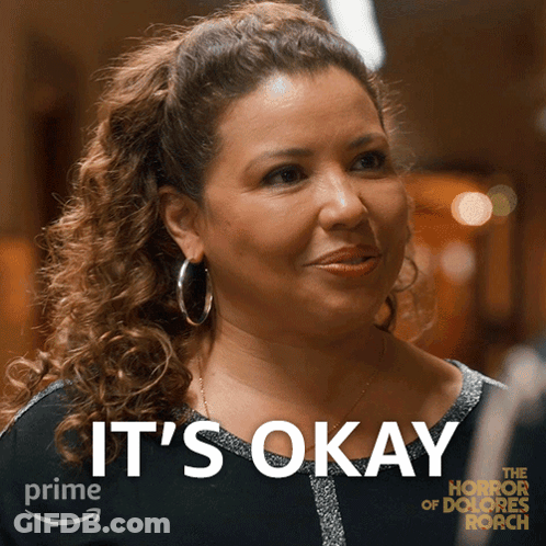 Woman Saying It's Okay In Front Of Picture GIF