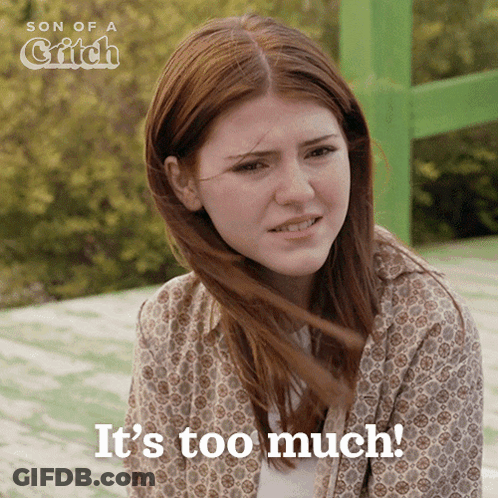 Woman Saying It's Too Much In Front Of Green Sign GIF