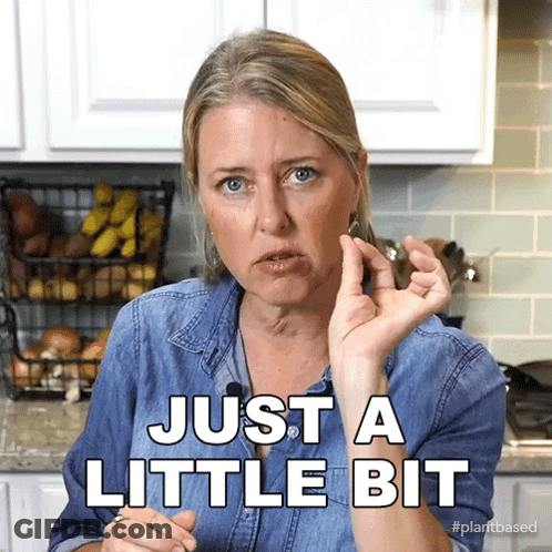 Woman Saying Just A Little Bit Beside Bananas GIF