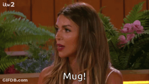 Woman Saying Mug Among Flowers GIF
