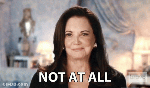 Woman Saying Not At All Smiling GIF