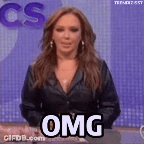 Woman Saying OMG In Front Of CBS Sign GIF