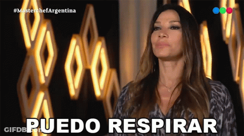 Woman Saying Puedo Respirar At Wall Of Lights GIF