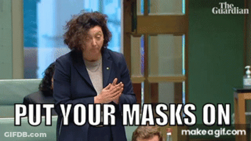 Woman Saying Put Your Masks On To Group GIF