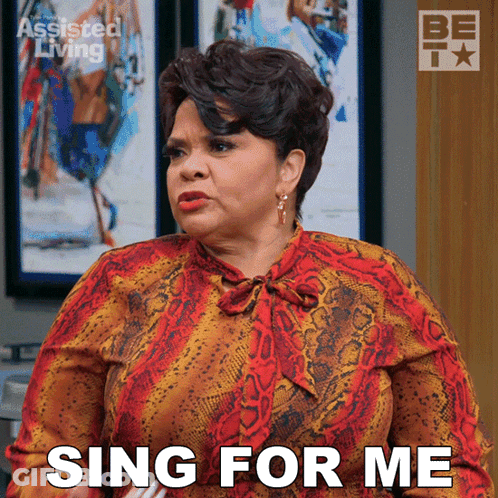 Woman Saying Sing For Me In Front Of Be TV Logo GIF