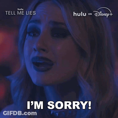 Woman Saying Sorry In Front Of Hulu Disney Plus Sign GIF