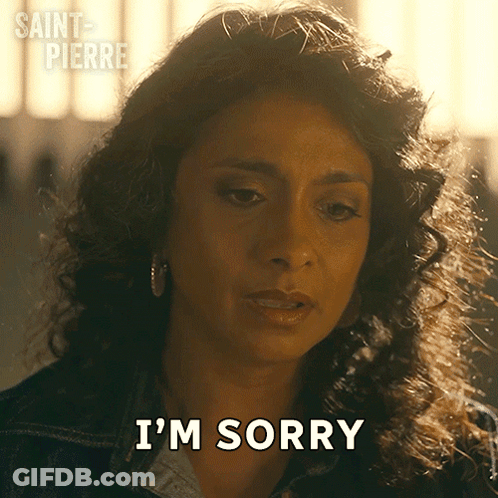Woman Saying Sorry In Front Of Saint Pierre Sign GIF