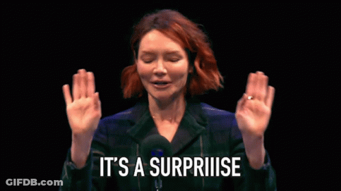 Woman Saying Surprise With Hands Up GIF