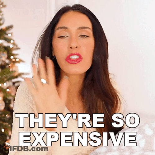 Woman Saying They're So Expensive By Christmas Tree GIF