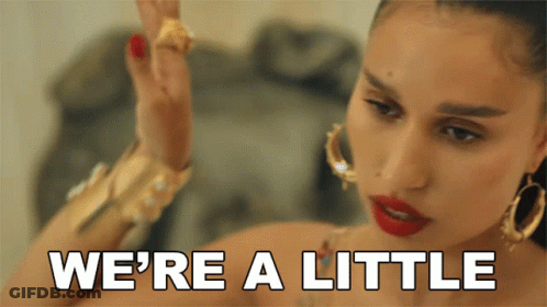 Woman Saying We're A Little While Wearing Hoop Earrings GIF