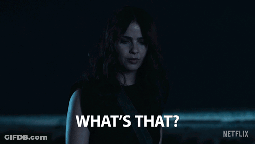 Woman Saying What's That In Dark Room GIF