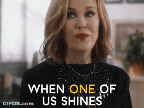 Woman Saying When One Shines In Black Top GIF