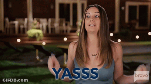Woman Saying Yasss In Front Of Building GIF