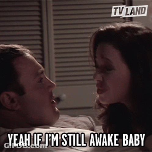 Woman Saying Yeah If I'm Still Awake Baby On Bed GIF