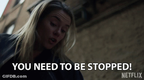 Woman Saying You Need To Be Stopped Outside Building GIF