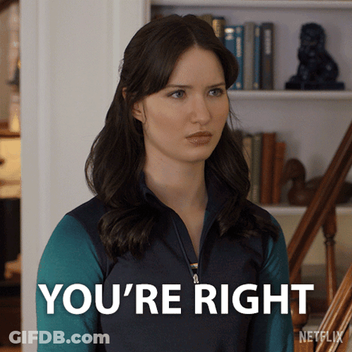 Woman Saying You're Right In Front Of Bookshelf GIF