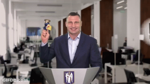 Woman Says Click The Notification Bell In Front Of Lights GIF