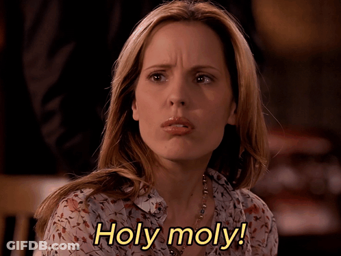 Woman Says Holy Moly With Floral Shirt GIF