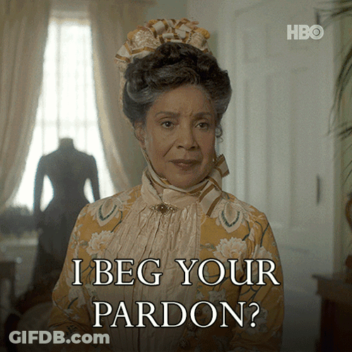 Woman Says I Beg Your Pardon In Yellow And White Dress GIF