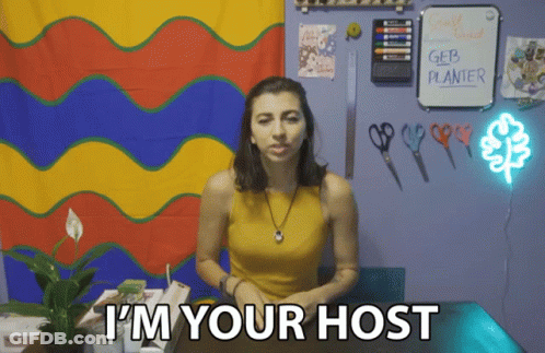 Woman Says I'm Your Host In Front Of Planter GIF
