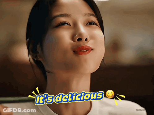 Woman Says It's Delicious With Smiley Face GIF