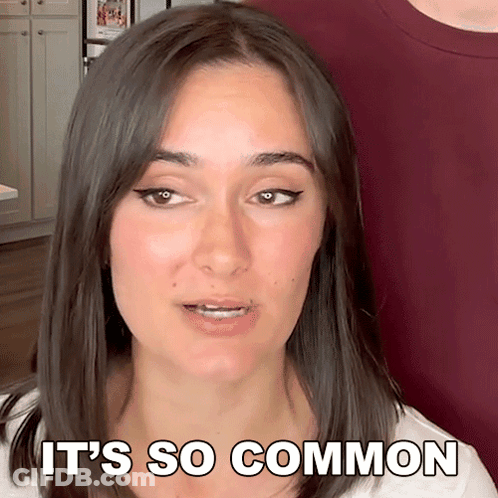 Woman Says It's So Common In Front Of Man In Red Shirt GIF