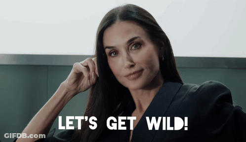 Woman Says Let's Get Wild With Hand On Ear GIF