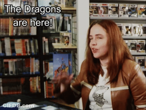 Woman Says The Dragons Are Here Bookshelf GIF