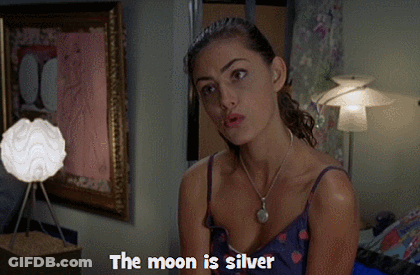Woman Says The Moon Is Silver In Front Of Lamp GIF