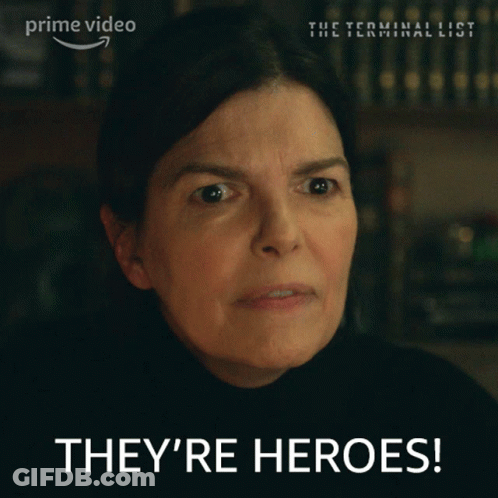Woman Says They're Heroes In Front Of Prime Video Sign GIF
