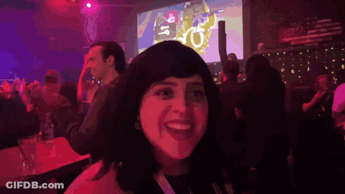 Woman Says We're In Front Of Large Screen GIF