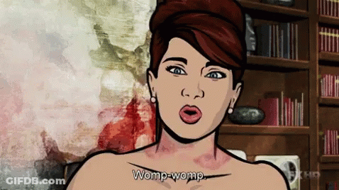 Woman Says Womp-Womp In Front Of Bookshelf GIF
