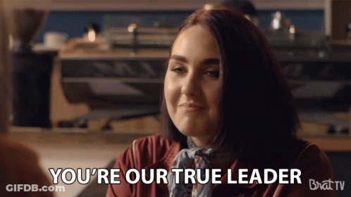 Woman Says You're Our True Leader Sitting At Table GIF