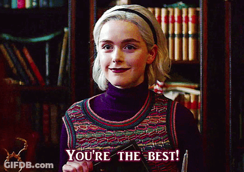Woman Says You're The Best In Front Of Bookcase GIF