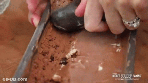 Woman Scooping Ice Cream From Loaf Pan GIF