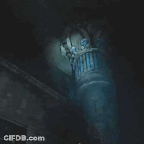 Woman Screaming In Dark Room With Pillar GIF