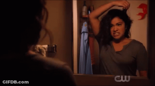 Woman Screaming In Front Of Mirror With CW Logo GIF