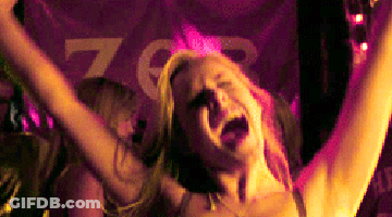 Woman Screaming With Arms In Air In Front Of ZGR Sign GIF