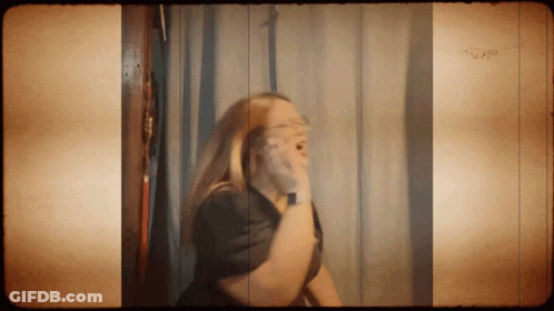 Woman Shaving Face In Mirror GIF