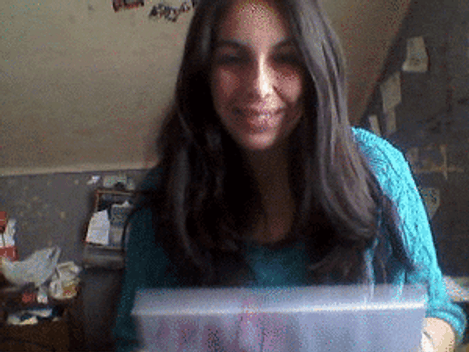 Woman Showing Feliz Sabado Cardboard GIF