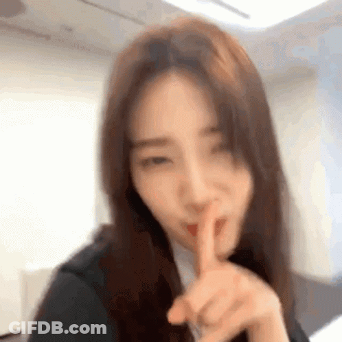 Woman Shushing With Finger To Lips GIF